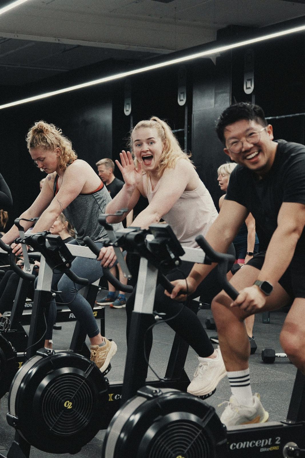 XO Fitness members smiling during a group conditioning session